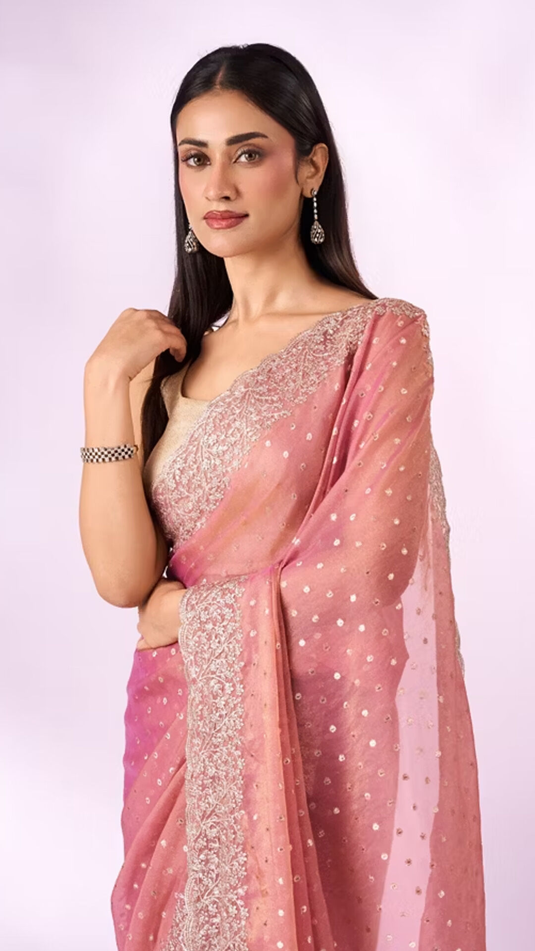 Women dressed in traditional sarees for Durga Puja festivities, reflecting the beauty of Bengali-inspired ethnic fashion and festive celebration